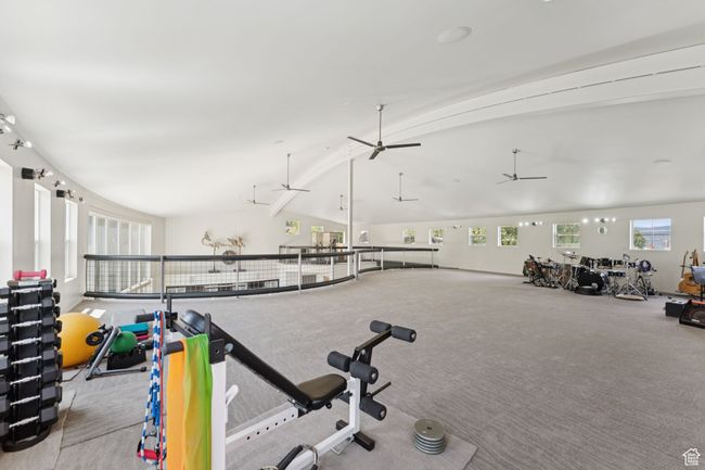 Workout area with healthy amount of natural light, a ceiling fan, and carpet flooring | Image 30