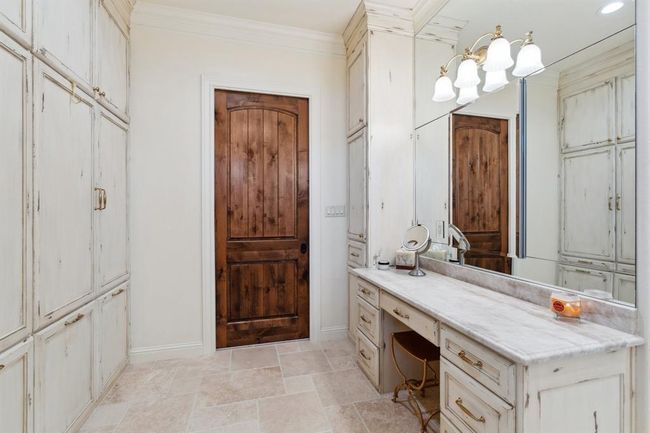 A separate make-up vanity area with knee space, a "Salon drawer, " and two storage cabinets. Yet another Robern MSeries Reserve mirrored and lightedvanity recessed cabinets, includinginterior magnification pull-out mirrors plus electrical outlets andmovable glass shelves! | Image 25
