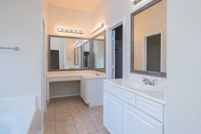Full bath with two vanities, a tub to relax in, Texas-sized walk-in closet | Image 21