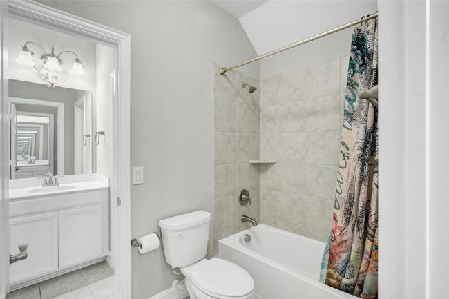 Jack and Jill bathroom features combination shower and tub. | Image 27