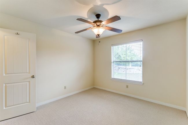 Spare room with light carpet and a ceiling fan | Image 17