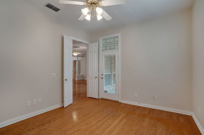 Spare room with a ceiling fan, baseboards, and light wood-style flooring | Image 16