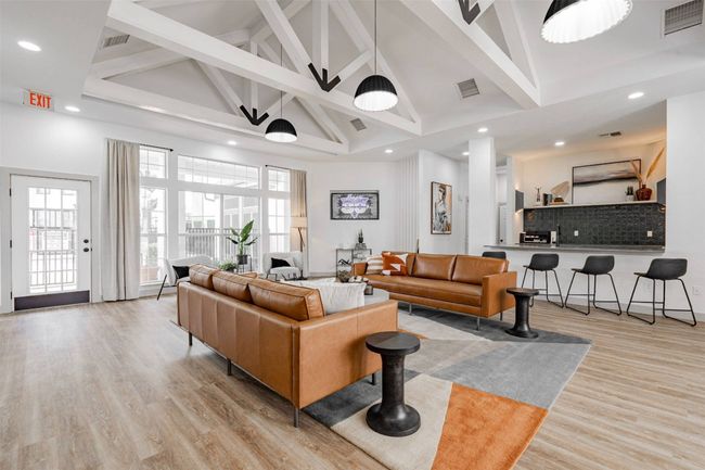 Living room with beamed ceiling, light wood-type flooring, and high vaulted ceiling | Image 14
