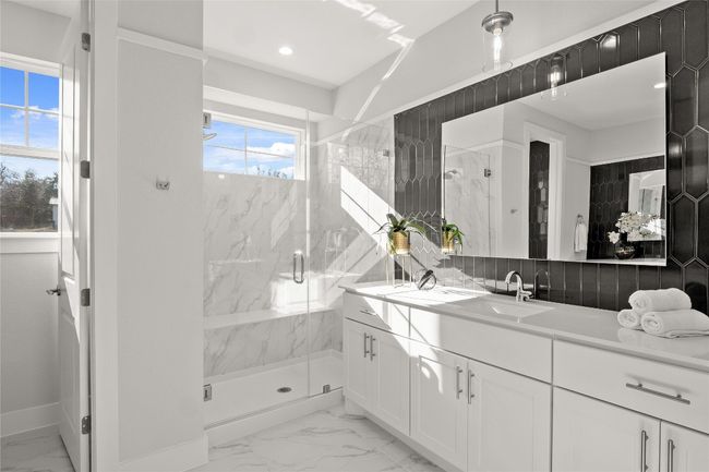 Bathroom with a marble finish shower, baseboards, recessed lighting, marble finish floor, and vanity | Image 20