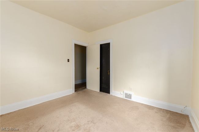 View of carpeted spare room | Image 18