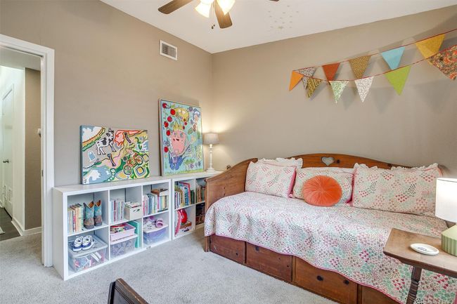 Carpeted bedroom featuring a ceiling fan | Image 19