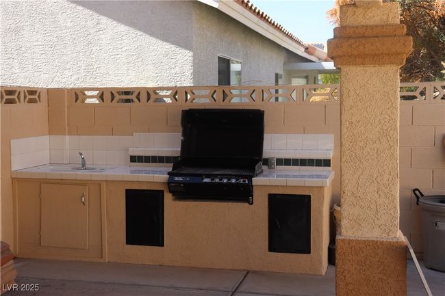 View of patio featuring an outdoor kitchen | Image 64