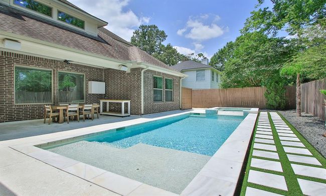Take a refreshing dip in this stunning pool, designed with a generous sun shelf for soaking up the sun. | Image 38
