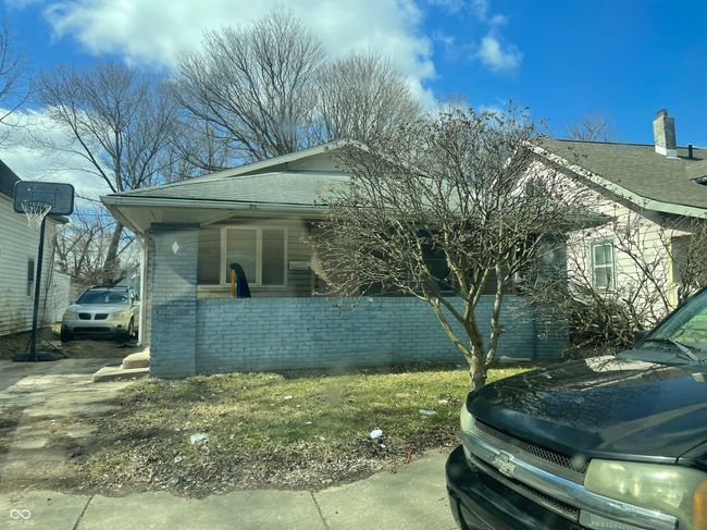 view of front of property with brick siding and a shingled roof | Image 4