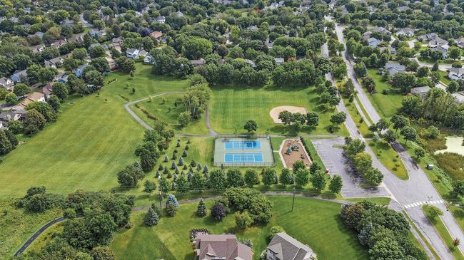 Highpoint park is a short walk from the Meadows of Elm Creek. Paved trails connecting much of the area make this easily accessible. Tennis courts, play structure and a fabulous hill for sliding in the winter with the grandkids! | Image 41