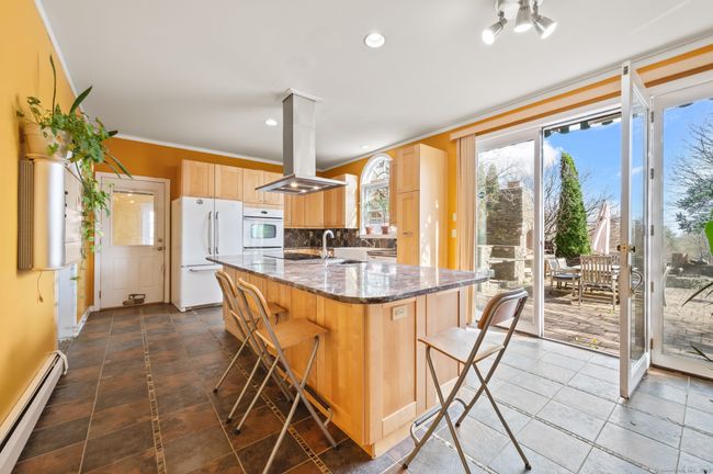 with view of French doors and stone terrace | Image 18