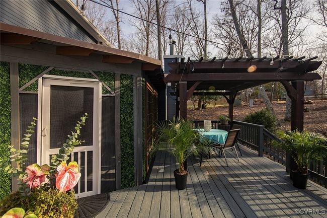 Wooden terrace featuring outdoor dining space | Image 39