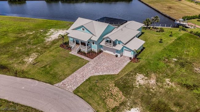 Aerial view of property and surrounding area with a large body of water | Image 41