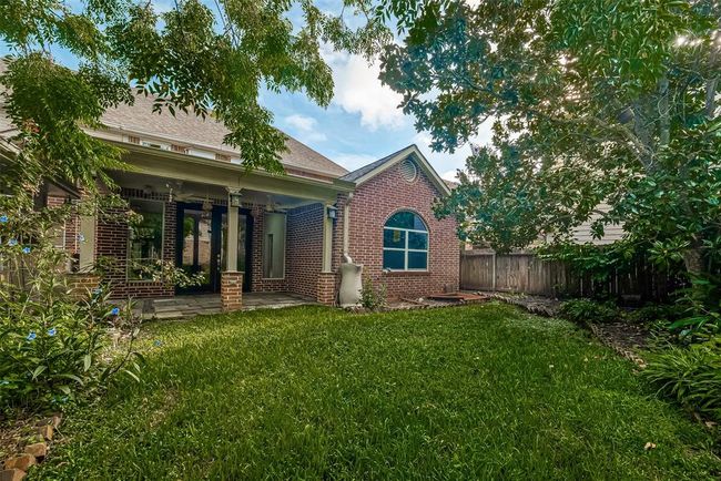 FULLY FENCED BACK YARD WITH SPRINKLER SYSTEM. | Image 46
