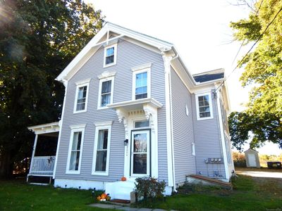 Front entrance to Unit A with beautiful front porch overlooking the front yard. | Image 3