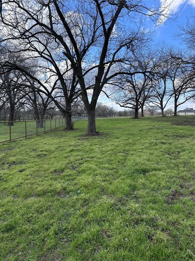 View of yard featuring fence and a rural view | Image 13