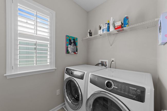 Washroom featuring washer and clothes dryer | Image 12