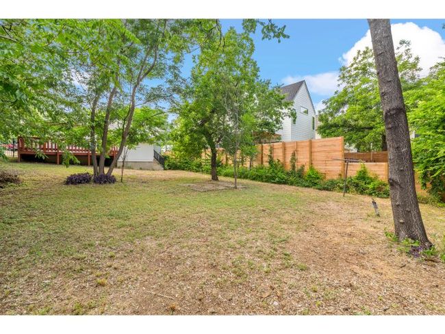 View of yard with a wooden deck | Image 11