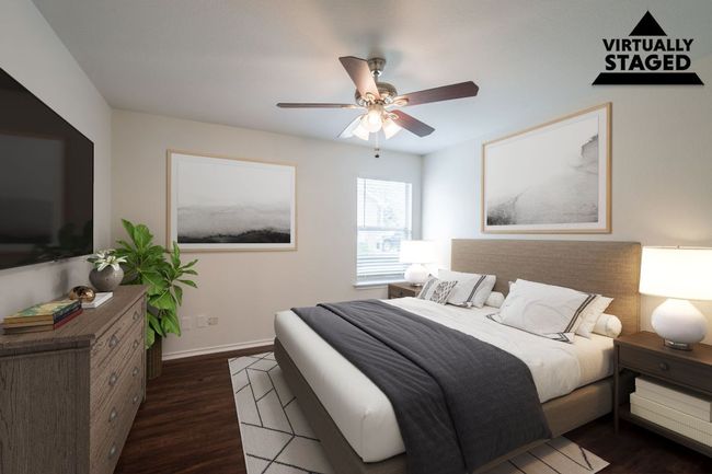 Bedroom with dark wood-type flooring, baseboards, and a ceiling fan | Image 22