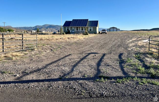 View of yard featuring a view of countryside, a mountain view, and driveway | Image 51