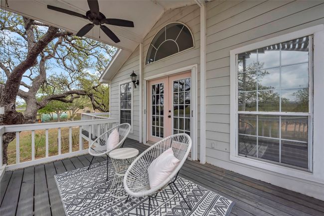 Wooden deck featuring french doors and a ceiling fan | Image 33