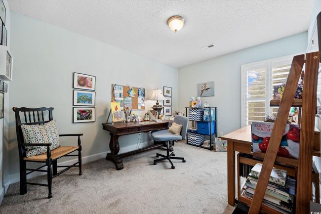 Office area with carpet and a textured ceiling | Image 32