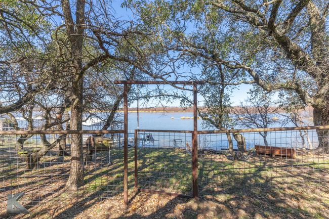 View of yard featuring a water view | Image 12