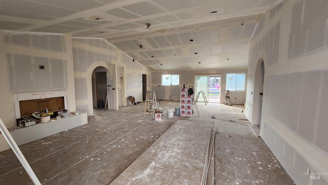 Living space with kitchen area as seen from the Living room looking towards back of home | Image 6