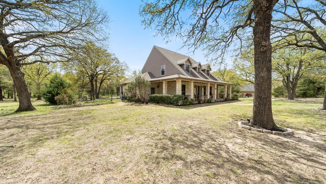 View of property exterior with brick siding and a yard | Image 33