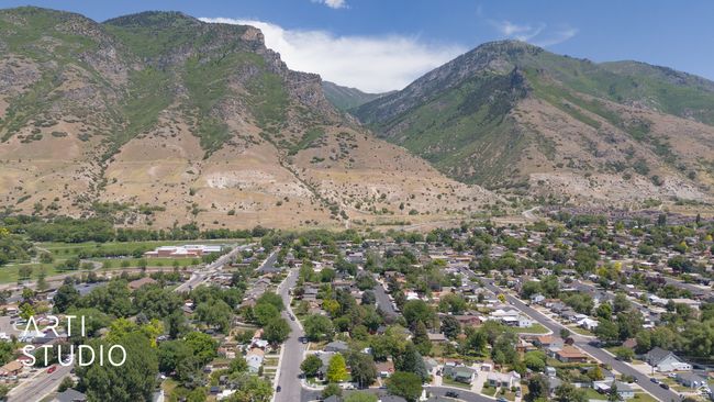Aerial overview of property's location with a mountainous background | Image 25