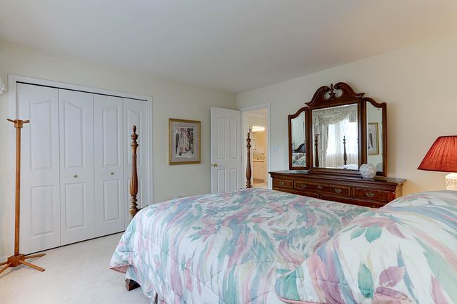 Bedroom with carpet floors and a closet | Image 33