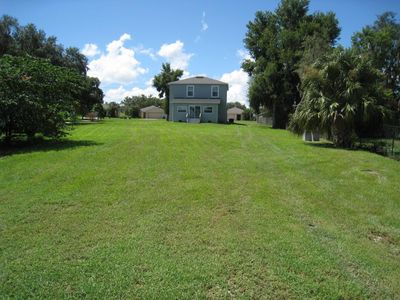 Rear of home and backyard. | Image 3