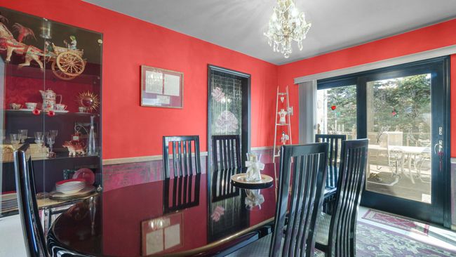 Dining space with a notable chandelier | Image 7