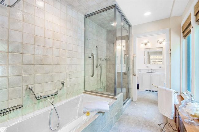 The window trim, vanity and bath tub have been virtually pointed. | Image 24