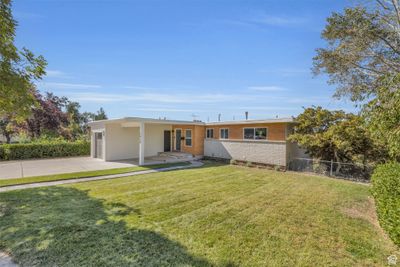 View of front of house with a garage and a front lawn | Image 2