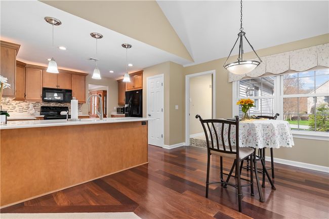 breakfast area in kitchen with patio access | Image 10