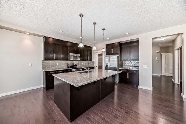 554 Sherwood Boulevard Nw, Home with 6 bedrooms, 3 bathrooms and 4 parking in Calgary AB | Image 4