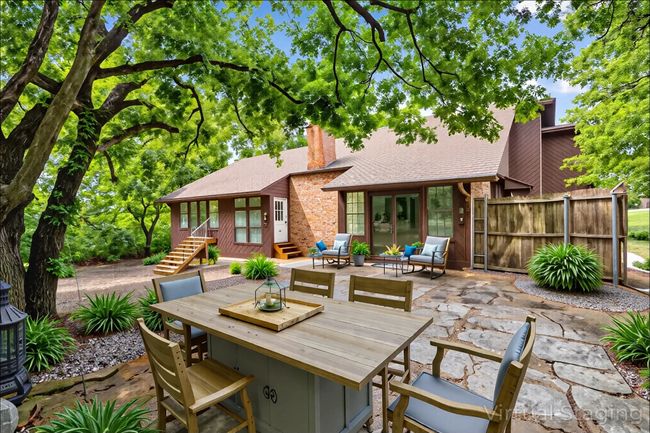Virtual staged : View of patio / terrace featuring entry steps, french doors, and outdoor dining area | Image 5