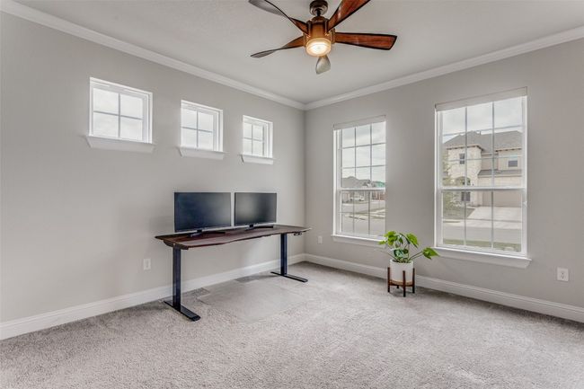 Carpeted office featuring crown molding and ceiling fan | Image 6