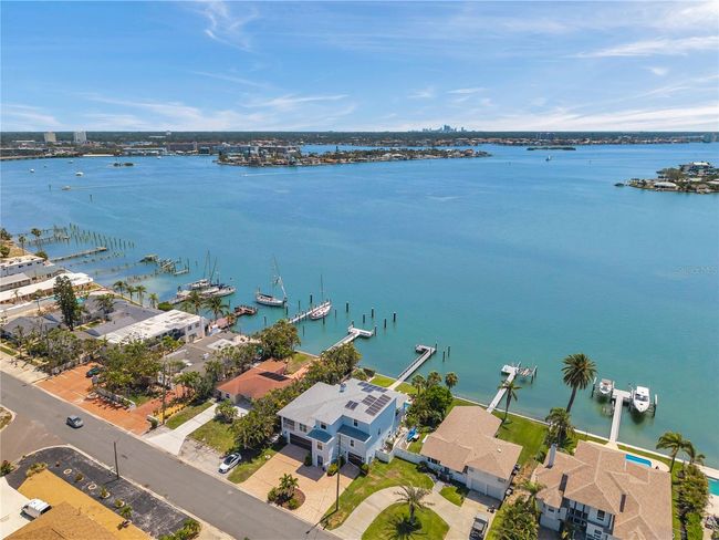 Aerial view showcasing the neighborhood of this luxury waterfront home. | Image 98