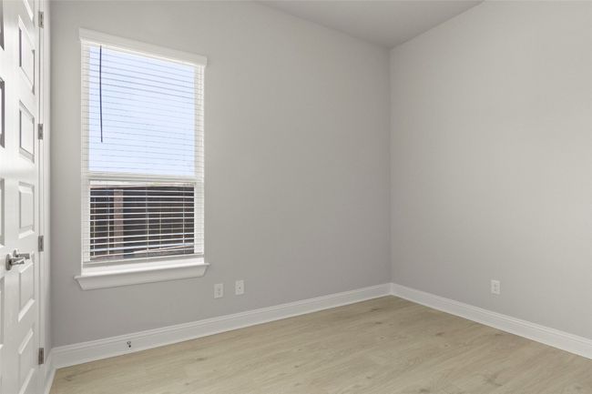 Empty room with wood finished floors and baseboards | Image 32