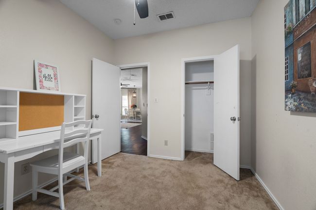Carpeted office with ceiling fan and baseboards | Image 25