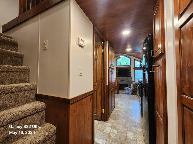 View from bedroom looking down hall to main living area | Image 15