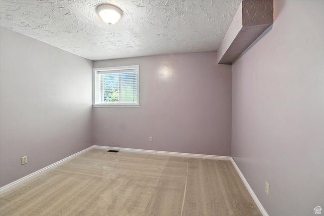 Carpeted basement bedroom | Image 22