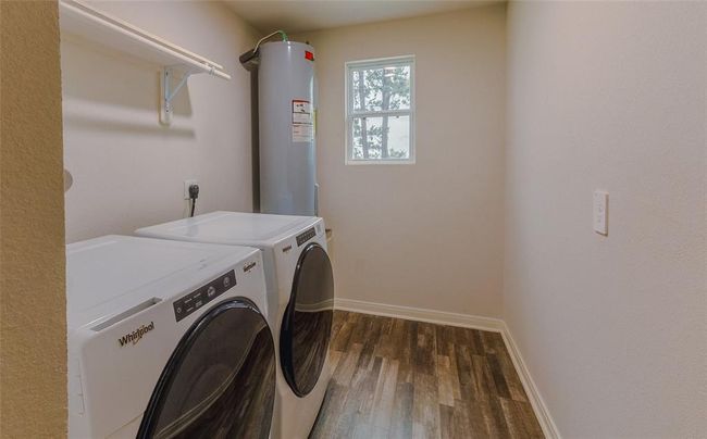 The laundry room is located on the second floor and is a nice size. | Image 26