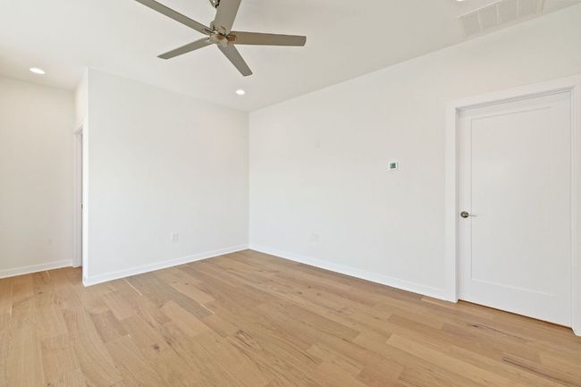 Unfurnished room featuring light wood flooring, baseboards, visible vents, and recessed lighting | Image 18