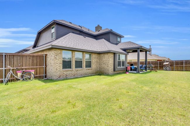 Back of structure featuring wooden fence | Image 35