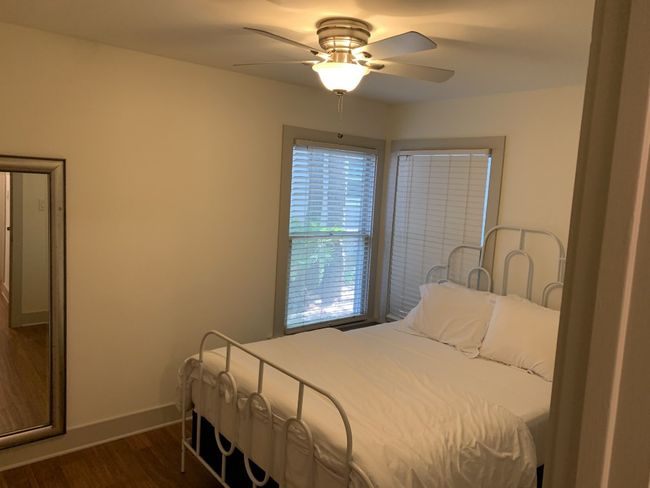 Secondary bedroom with a ceiling fan | Image 12