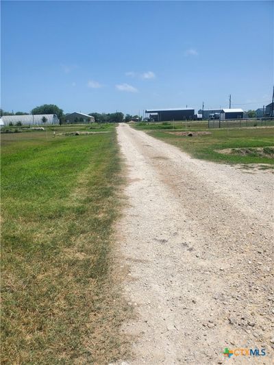 Front view of lot on left in pic; with view of Sandhill Lane access. | Image 2