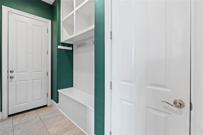Mud room with access to the garages. | Image 16